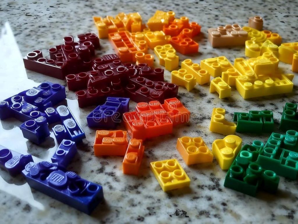 Close-up of colorful LEGO bricks stacked together, showing the quality and precision that contribute to their high cost