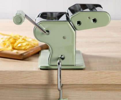 Close-up of fresh pasta being prepared using Sur La Table kitchen tools.