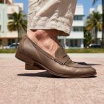 Person checking proper shoe fit before walking